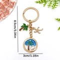 Goldener Seestern Schlüsselanhänger mit Kokospalme und Perlenanhänger, Länge 8,5cm - Blau Ölgemälde Kokosnuss Seestern