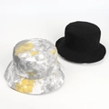 Flat lay of a solid black bucket hat and a yellow tie-dye patterned hat on white background - M (55-59cm) / Smoke Grey & Yellow Tie-dye (Reversible)