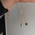 Collane vintage placcate oro 18K con cristalli rettangolari champagne e blu scuro - Collana Bagliore Champagne