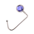 Detail of silver portable table hook featuring a faceted purple crystal stone inlay - Blue Purple