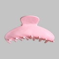 Detail of pink glossy acetate shark hair claw clip with multiple comb teeth - Pink