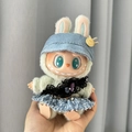 Plush doll accessory featuring a denim hat and black lace bow on a green furry figure - Black Feather Kiss + Blue Baseball Cap / First And Second Generation Keychains Are Compatible With La Cloth Dolls. Dolls Not Included.