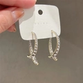 Elegant gold-tone crisscross hoop earrings with sparkling white pavé rhinestones - 1701 Gold