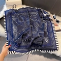 Close-up of a navy paisley faux silk square scarf with classic striped borders and soft texture - 70*70cm / Dark Blue Paisley