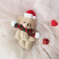 Cute beige plush teddy bear with red Christmas hat and scarf as a soft gift accessory - Brown Bear With Green Red Scarf
