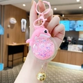 Roze dolfijn sleutelhanger met vloeibare glitters en een gouden belletje eraan - Dolfijn / Roze