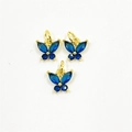 Detailed view of three golden butterfly pendants with inlaid blue zircon stones - Pendant Only / Blue