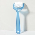 Manual handheld face roller massager with blue handle and textured white roller head - Blue