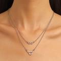 Silver infinity and heart layered necklace on model, minimalist double chain design - Double Layer Infinity Heart (7117) / Silver