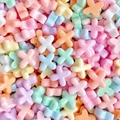 Macro shot of X-shaped resin letter beads in pastel macaron colors for DIY crafts - Letter X (Random Mixed One) / Small