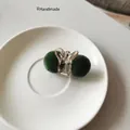 Cute plush hair clip with dark green faux fur balls on transparent acrylic claw - Dark Green