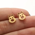 Polished gold stainless steel reindeer stud earrings shown on fingertip for scale - Gold Reindeer (660)