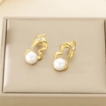 Close-up of golden geometric earrings with large white pearls and sparkling rhinestones - Gold Streamline Pearl Style (29x14mm)