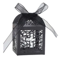 Close-up of black laser-cut favor box with a cross pattern and organza ribbon bow - Black