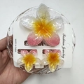Macro detail of pink yellow gradient flower hair clips with shimmer resin finish - First Love Snowflake Red Set (with Card)