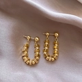 Polished gold U-shaped drop earrings with geometric beads on elegant silk fabric - Triangle Spliced / Gold