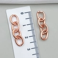 Pair of rose gold oval link earrings shown with a ruler for size measurement - 27x7mm (1.0g) / Rose Gold