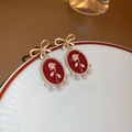 Rosa rossa con fiocco e perla (38#)
