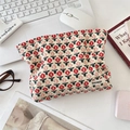 Detailed corduroy makeup bag with tulip pattern on a tidy office desk setup - Little Red Flower