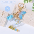 Ocean beach style letter Z keychain with resin starfish shell and blue tassel - Letter Z