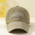 Close-up of embroidered California West Coast text on a washed khaki baseball cap - Adjustable / Khaki