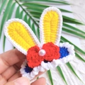 Handmade crochet bunny ear hair clip for girls with a red bow and white pearl accent - Blue Yellow Red Fairy Tale Rabbit Ears