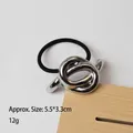 Elastic hair tie with geometric silver metal knot, measuring 5.5x3.3cm and 12g weight - Knotted Design Silver