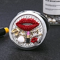 Portable silver makeup mirror with red lips, dress, and lipstick design on pearl base - Silver Metal