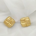 Detail of golden square stud earrings with intricate woven texture on white fabric - Woven Square Style (XL1464-49)