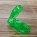 Transparent green pill cutter with V-shaped slot for precise tablet splitting and storage - Transparent Green Pill Cutter