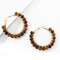 Detail of wire-wrapped gold hoop earrings with polished brown tiger eye stone beads - Brown Cat Eye Stripe Beads / Tiger's Eye