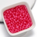 Pink acrylic beads for DIY jewelry making displayed in a white ceramic bowl - Glass Faux Jade Bead - Rose Red