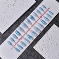 Detail of almond-shaped blue gradient press-on nails with 3D bows and pearls - Ice Blue Gradient Bow Style (WY-004) / Multi-piece Box Set