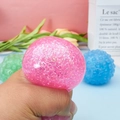 Squeezing pink glitter strawberry stress ball with liquid filling and shiny particles - Grape Ball-Random Color