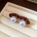 Brown flocked velvet and large white pearl stud earrings on cream jewelry tray - Light Coffee