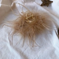 Detailed view of brown ostrich feather hair claw clip on a rustic beige linen background - 13CM Light Brown Feather Claw Clip