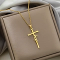 Macro detail of gold stainless steel cross necklace featuring an elegant Hope script pendant - HOPE / Gold