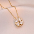 Macro detail of gold four-leaf clover necklace with sparkling heart-shaped zircons on silk - White Heart Clover (Gold Chain)