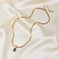 Elegant gold snake chain necklace with black rectangular zircon pendant on silk - Gold Black Zirconia