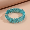Detailed close-up of triple-layered blue crystal beads with sparkling silver spacers - Blue