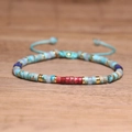 Adjustable woven bracelet with multi-color imperial stone beads and golden spacers - No.91 Blue & Red Imperial Cord