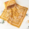 Detail of a ginger silk-feel square scarf with paisley pattern and elegant decor - 70*70cm / Yellow