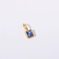 Minimalist square gold pendant featuring a vibrant blue zircon stone on white background - September Birthstone Pendant