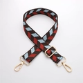 Detail of adjustable brown nylon shoulder strap with red and blue geometric patterns - J44-A8-Blue Red Herringbone