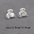 Silver plated leaf shape earring pendants with loop, size 1.9x1.9cm on grey background - Silver Exquisite Leaf Style (M60020)