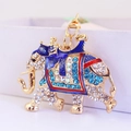 Sparkling crystal elephant keychain with blue rhinestones and gold-tone metal plating - Blue