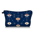 Detailed view of evil eye pattern on dark blue travel cosmetic bag with zipper - Navy Mystical Symbols Print