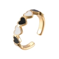 Adjustable gold open ring featuring alternating black and white enamel heart charms - Black and White / Adjustable Open