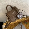 Mini brown PU leather crossbody bag with cute bear emblem and matching bear charm decoration - Brown