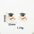 Graduation charms for DIY jewelry featuring cap and book with 26x22mm dimensions - Book and Graduation Cap